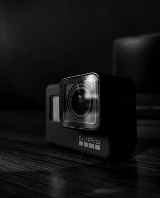 Action camera on table in dark room